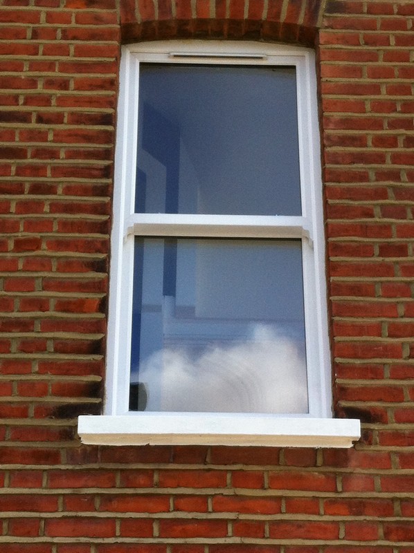 uPVC sash window on Victorian red brick house in Friern Barnet